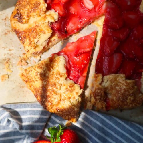 slice of strawberry galette on parchment paper