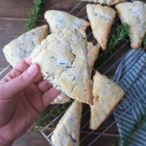 holding freshly baked rosemary scones