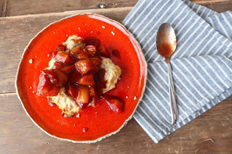 single serve drop biscuit topped with warm plum compote