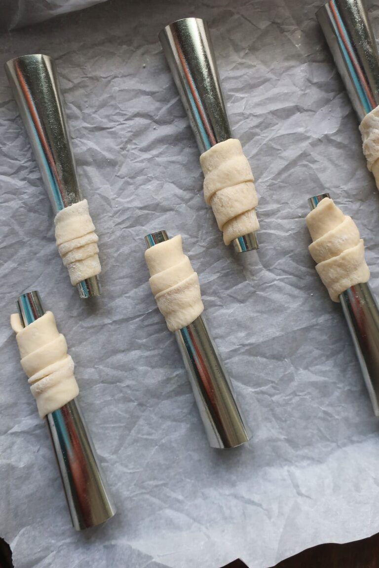 puff pastry dough wrapped around rods for lady lock recipe