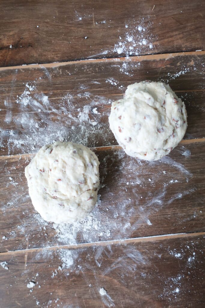 scone dough formed into two balls ready to shape