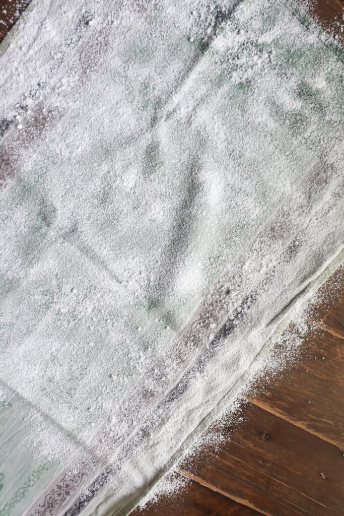 tea towel dusted with powdered sugar for cake roll