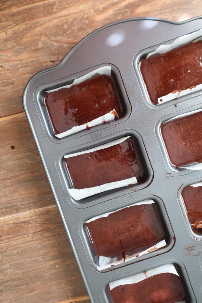chocolate cake batter in mini pans