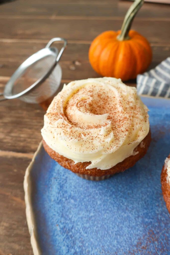 individual pumpkin cupcake with cream cheese frosting