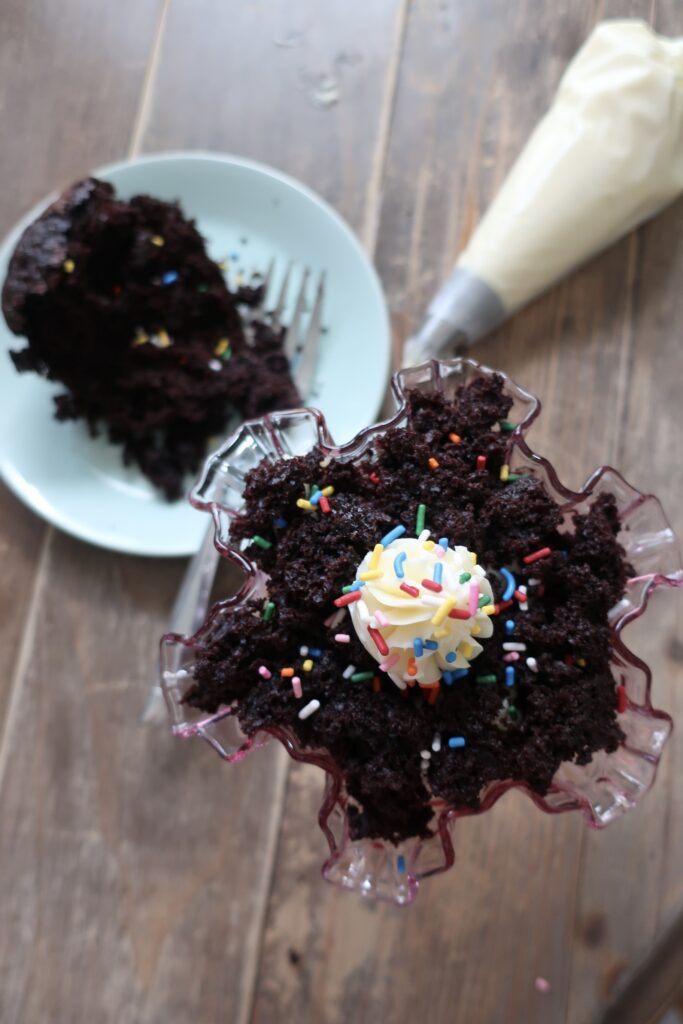 chocolate cake trifle with vanilla buttercream and sprinkles