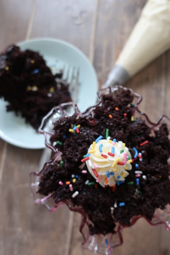 chocolate cake trifle with vanilla buttercream and sprinkles