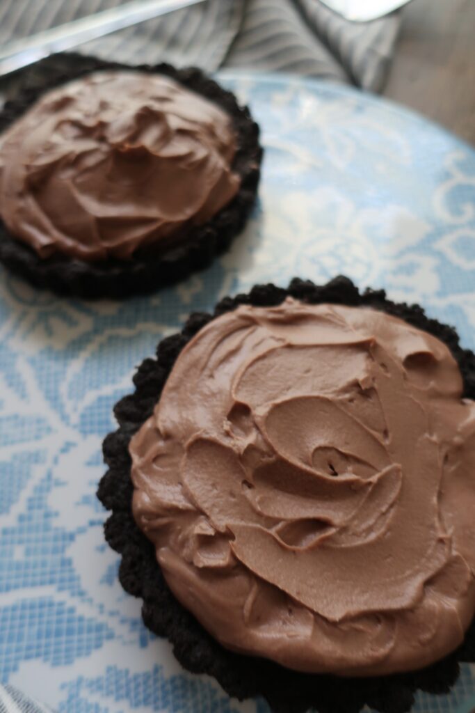 triple chocolate brownie pies with oreo crust, double chocolate brownies, and whipped milk chocolate ganache