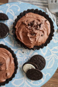 triple chocolate brownie pies with oreo crust, double chocolate brownies, and whipped milk chocolate ganache