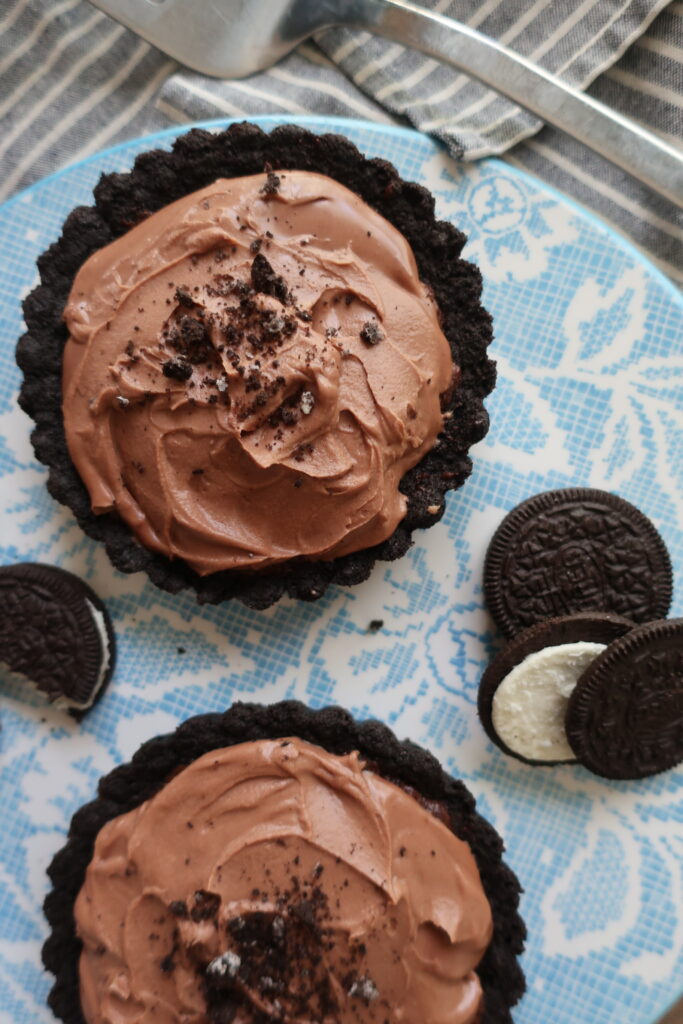 triple chocolate brownie pies with oreo crust, double chocolate brownies, and whipped milk chocolate ganache