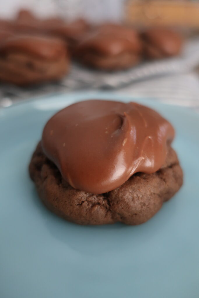 close up of texas sheet cake cookies; fudgy chocolate frosting; chocolate cookies with chocolate frosting; cake-like cookies