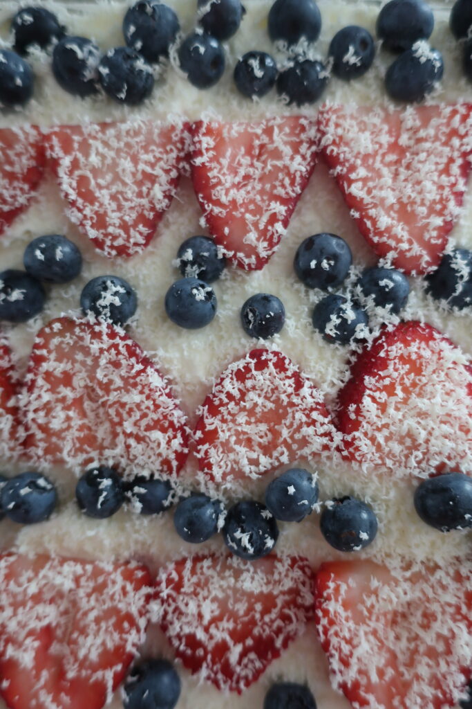 berry tiramisu with blueberries and strawberries, homemade lady fingers dunked in a mixed berry simple syrup, and a whipped marscapone; fourth of july dessert; red, white, and blue dessert; cold dessert