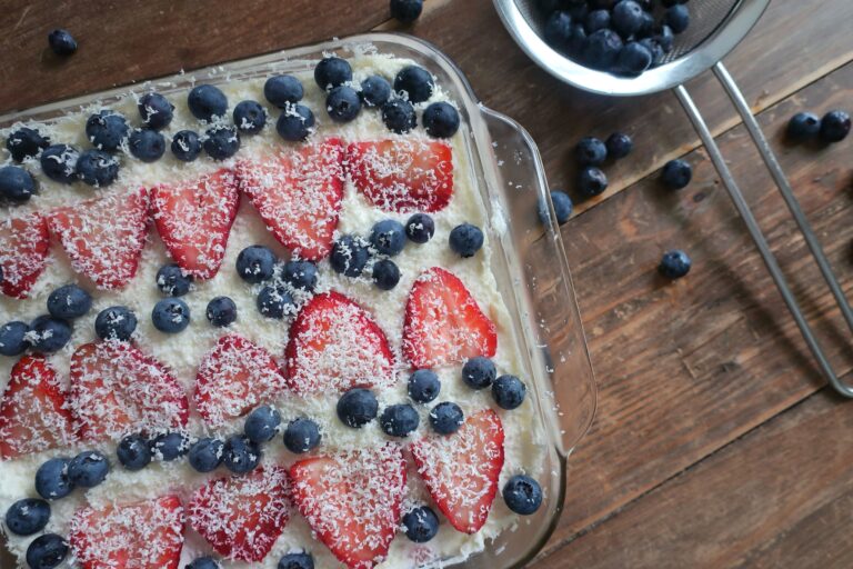 berry tiramisu with blueberries and strawberries, homemade lady fingers dunked in a mixed berry simple syrup, and a whipped marscapone; fourth of july dessert; red, white, and blue dessert; cold dessert