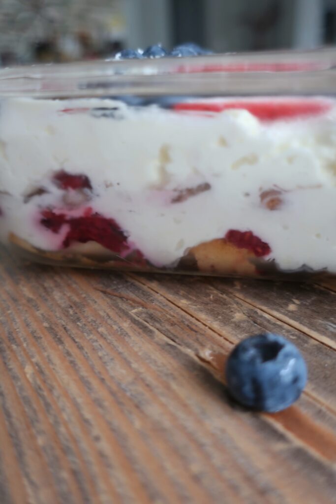 berry tiramisu with blueberries and strawberries, homemade lady fingers dunked in a mixed berry simple syrup, and a whipped marscapone; fourth of july dessert; red, white, and blue dessert; cold dessert