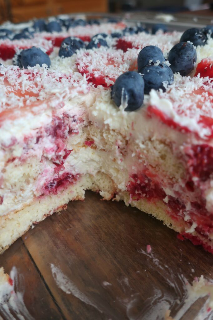 berry tiramisu with blueberries and strawberries, homemade lady fingers dunked in a mixed berry simple syrup, and a whipped marscapone; fourth of july dessert; red, white, and blue dessert; cold dessert