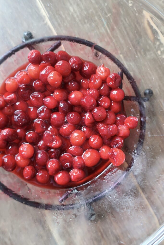 bowl of cranberry consomme