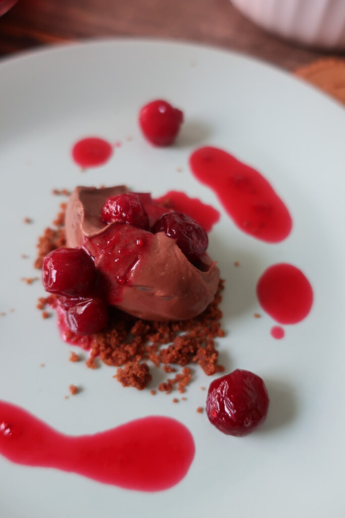 sea salt chocolate mousse with cranberry consomme and biscoff crumble