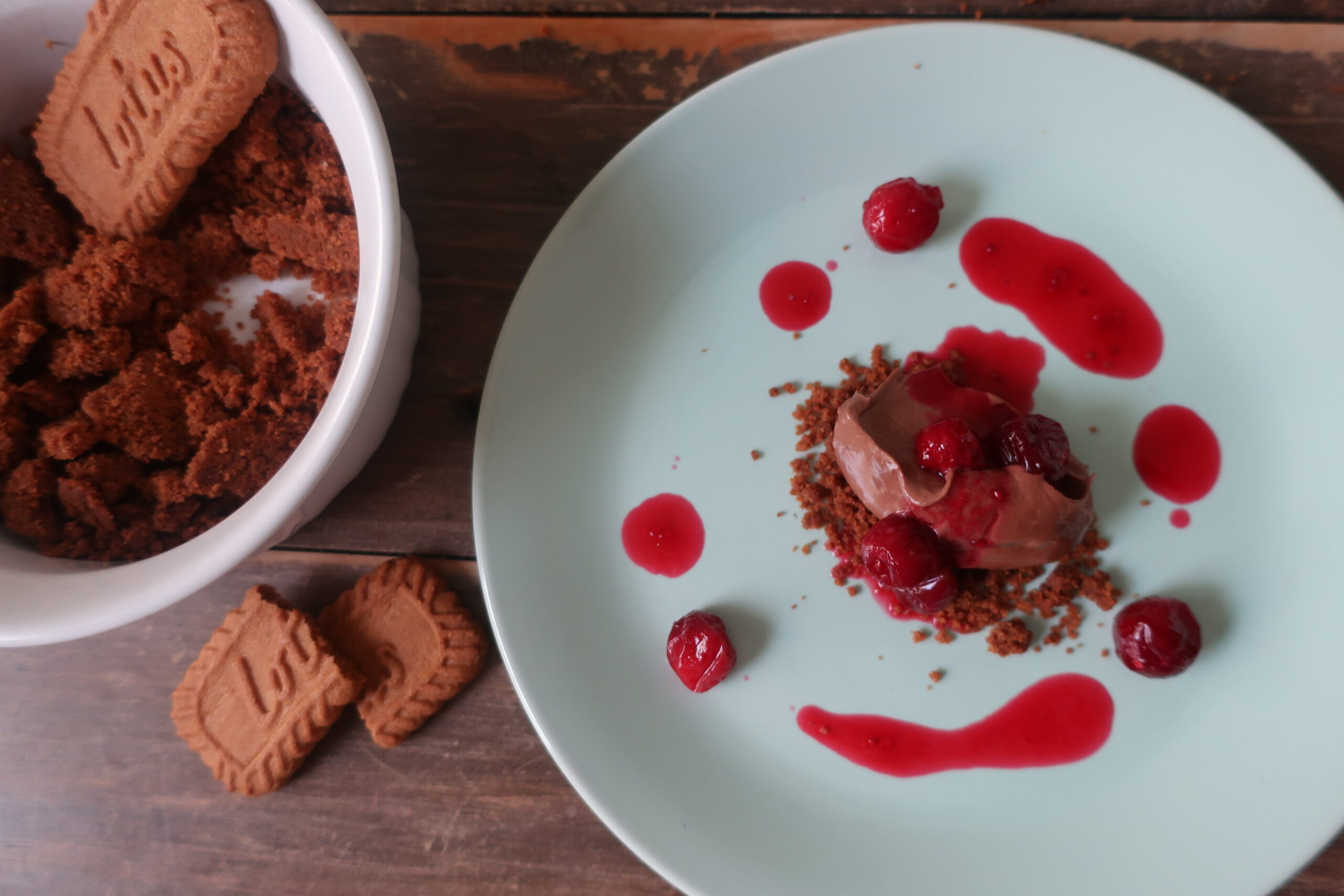 sea salt chocolate mousse with cranberry consomme and biscoff crumble