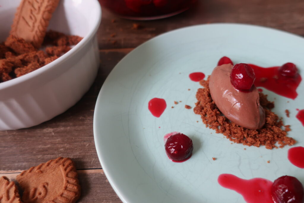 sea salt chocolate mousse with cranberry consomme and biscoff crumble