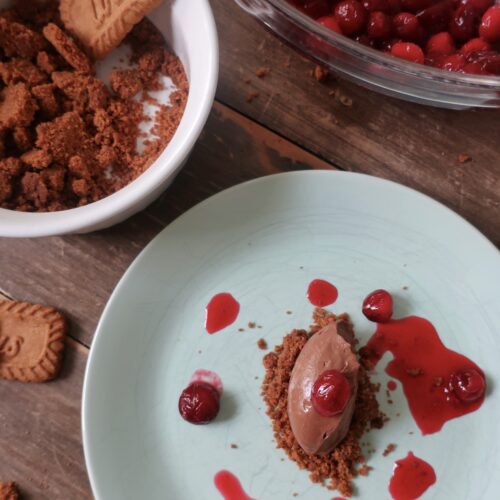 sea salt chocolate mousse with cranberry consomme and biscoff crumble