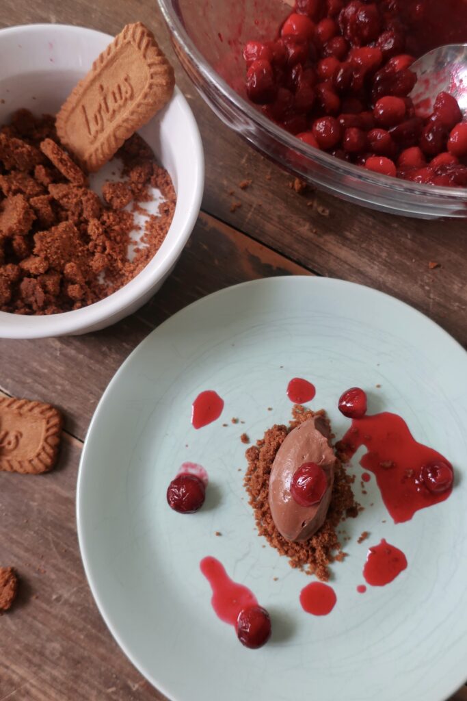 sea salt chocolate mousse with cranberry consomme and biscoff crumble