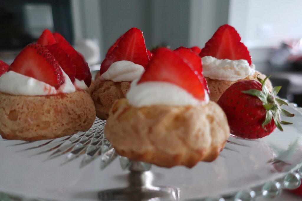 plain choux au craquelin with fresh strawberries and whipped cream