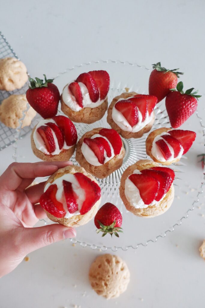 plain choux au craquelin with fresh strawberries and whipped cream