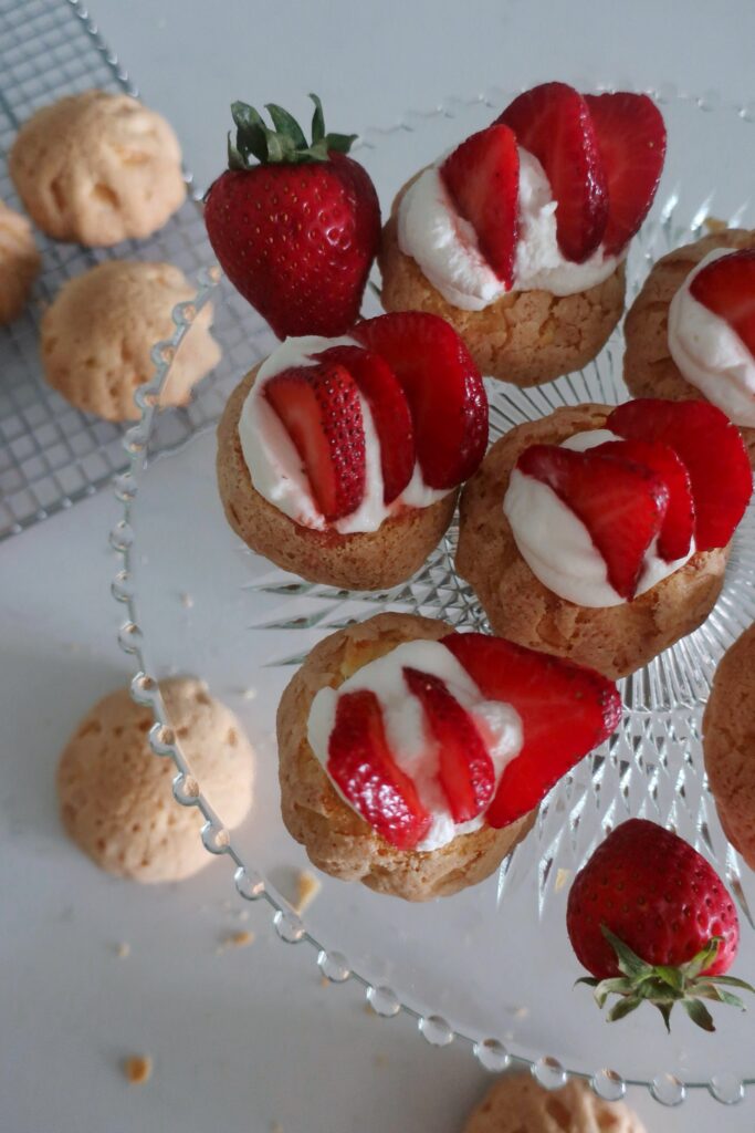 plain choux au craquelin with fresh strawberries and whipped cream