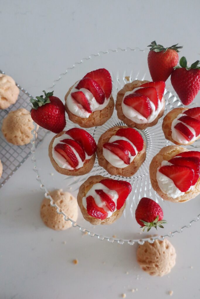 plain choux au craquelin with fresh strawberries and whipped cream