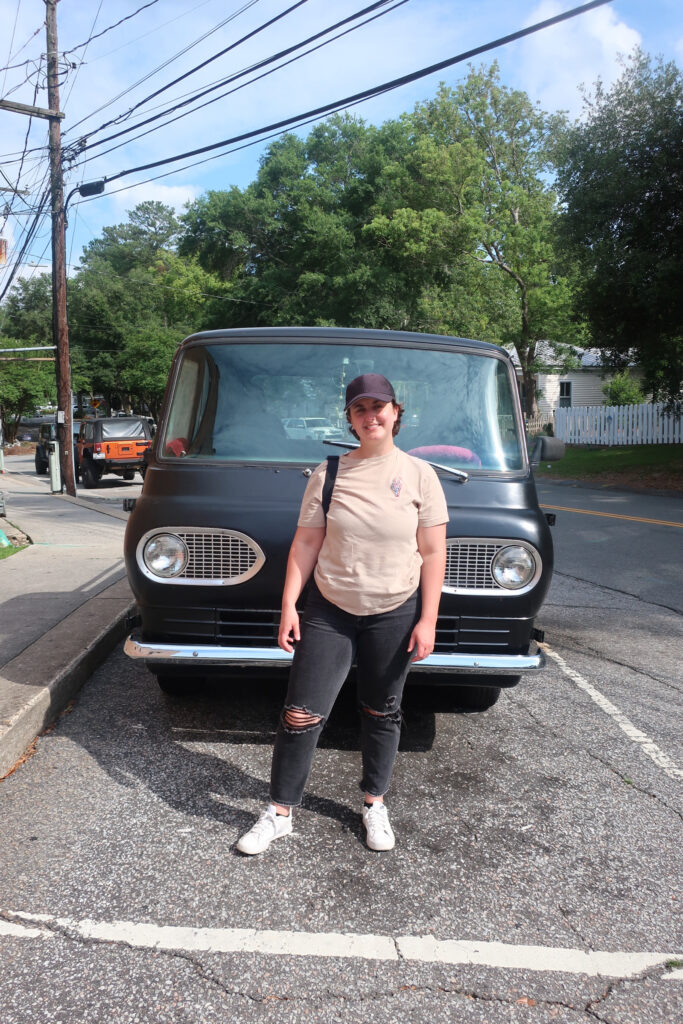 woman in front of class black truck in summerville south carolina; towns to visit in south carolina; roadtrip south carolina; small town usa; usa roadtrip; solo travel