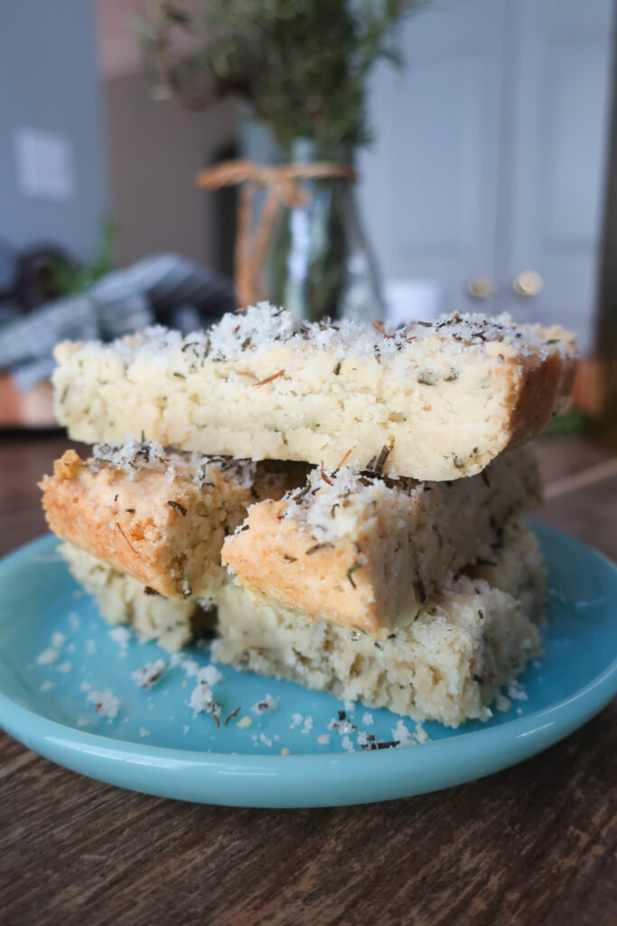 stacks of rosemary shortbread topped with rosemary sugar