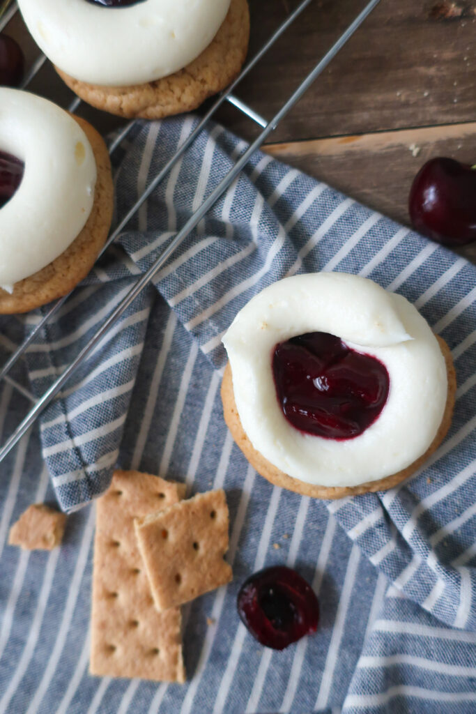 cherry cheesecake cookies; cream cheese frosting; cherry pie filling; graham cracker cookies