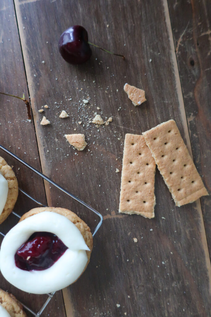 cherry cheesecake cookies; cream cheese frosting; cherry pie filling; graham cracker cookies