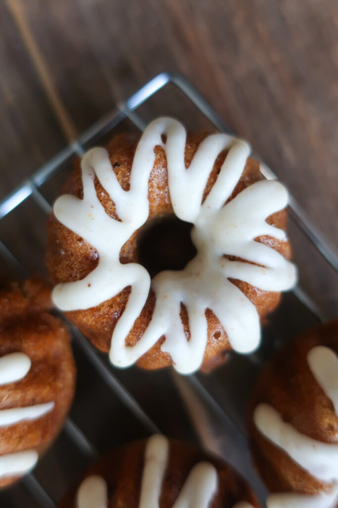 brown butter vanilla glaze over spiced mini bundt cakes