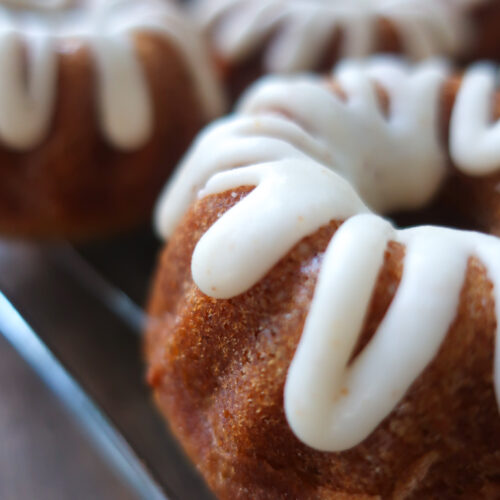 brown butter vanilla glaze over spiced mini bundt cakes