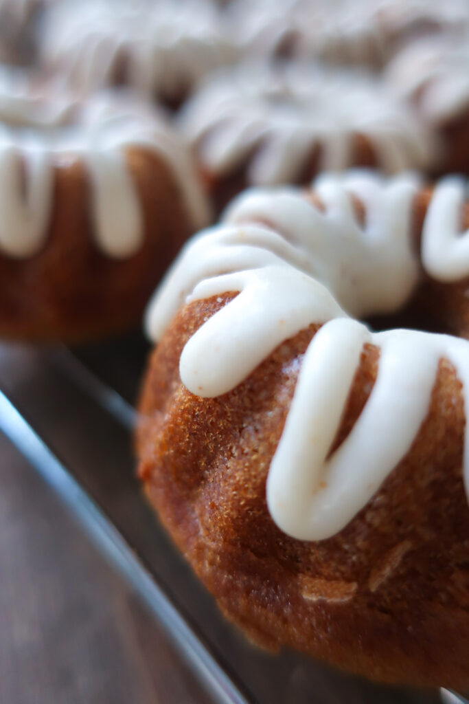 brown butter vanilla glaze over spiced mini bundt cakes