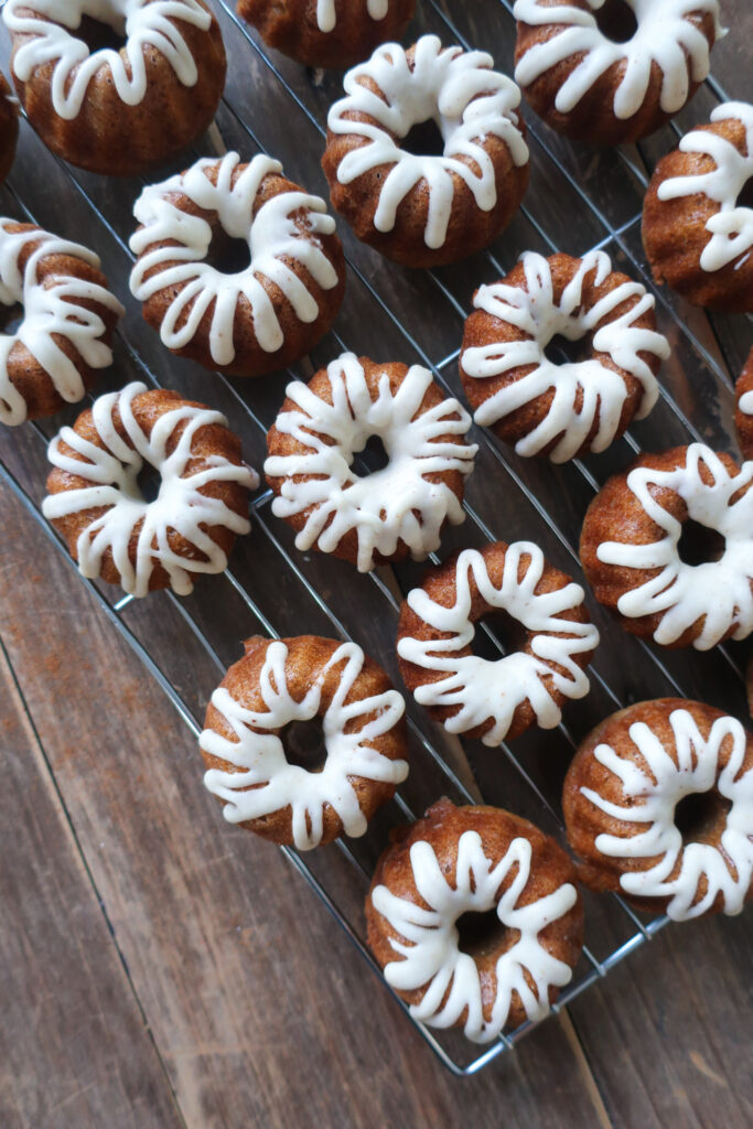 brown butter vanilla glaze over spiced mini bundt cakes