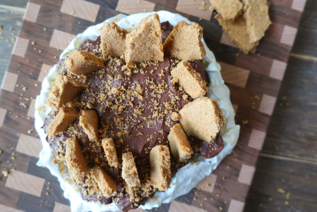 s'mores pavlova with french meringue, dark chocolate ganache, and graham cracker crust topping