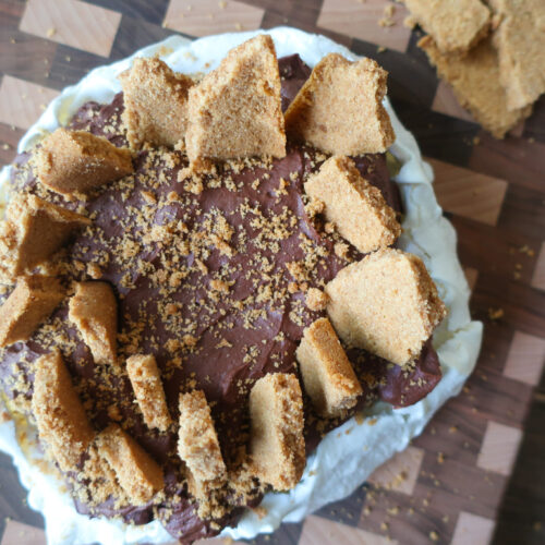 s'mores pavlova with french meringue, dark chocolate ganache, and graham cracker crust topping