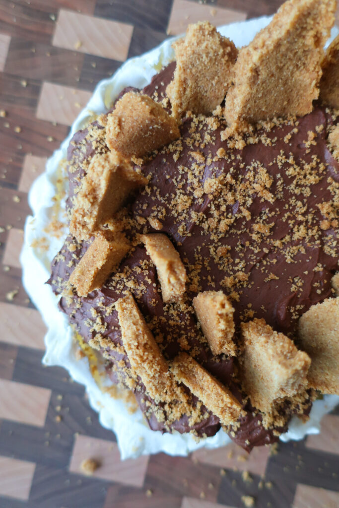 s'mores pavlova with french meringue, dark chocolate ganache, and graham cracker crust topping