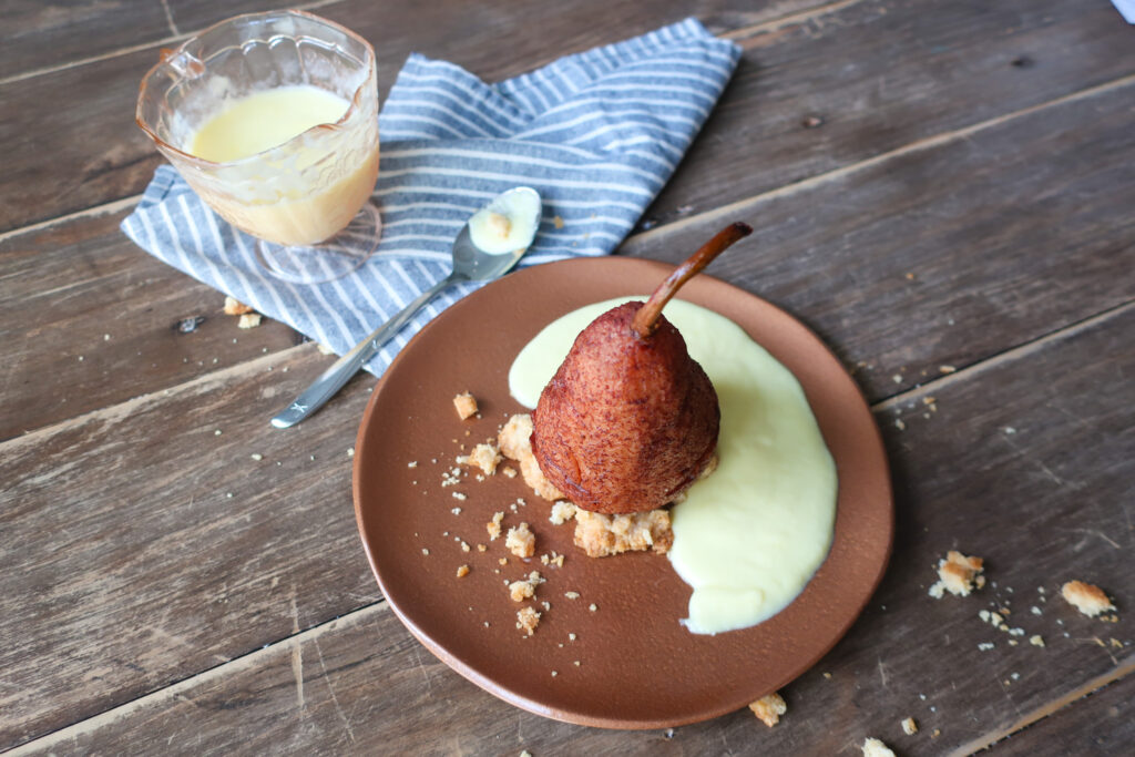 single serve spiced poached pear with streusel and creme anglaise