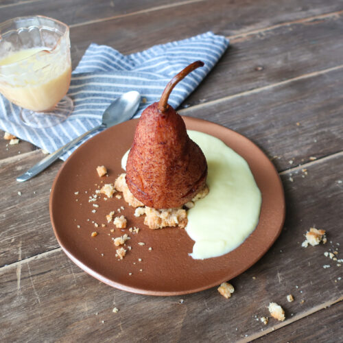 single serve spiced poached pear with streusel and creme anglaise