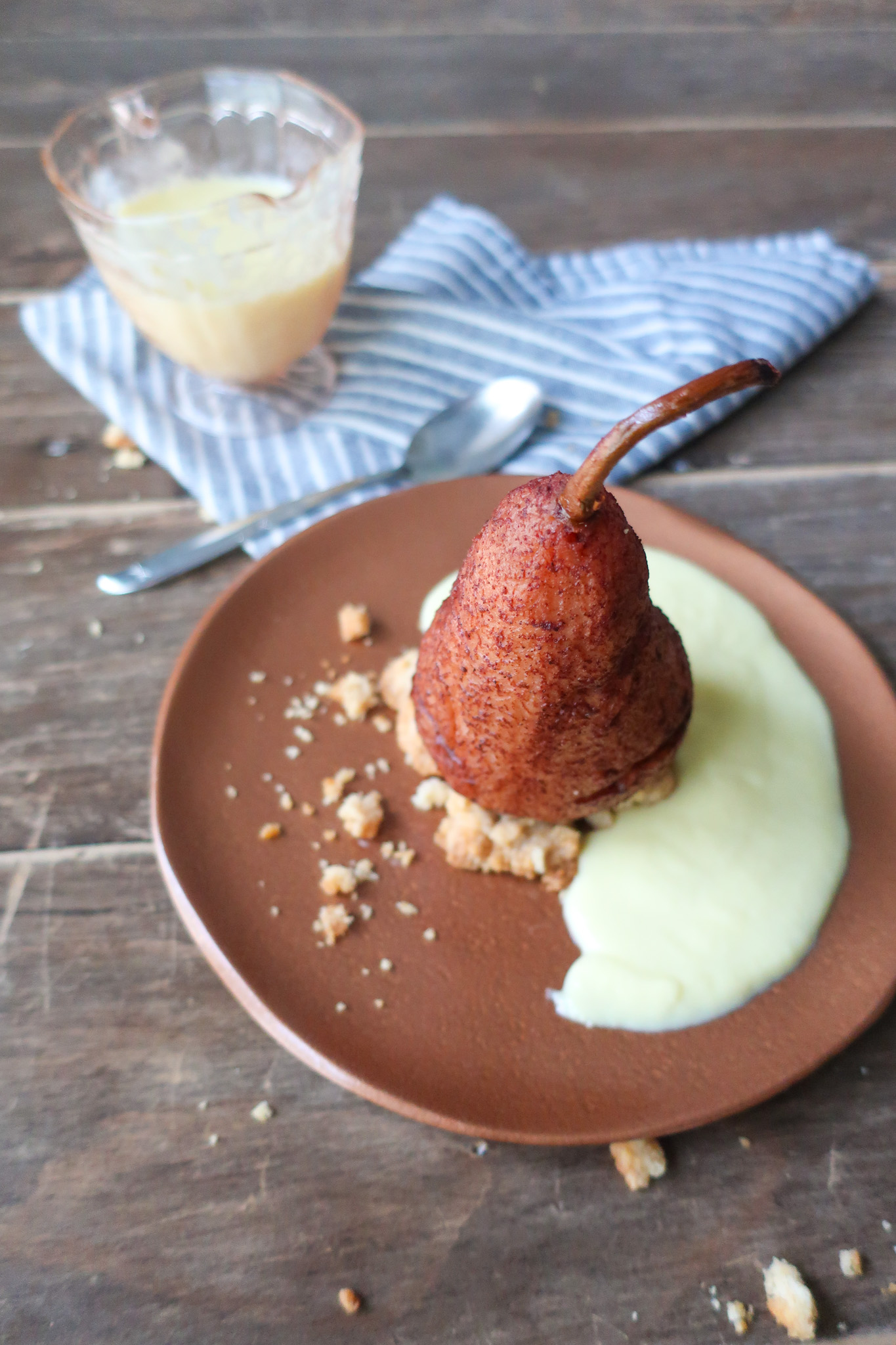 single serve spiced poached pear with streusel and creme anglaise