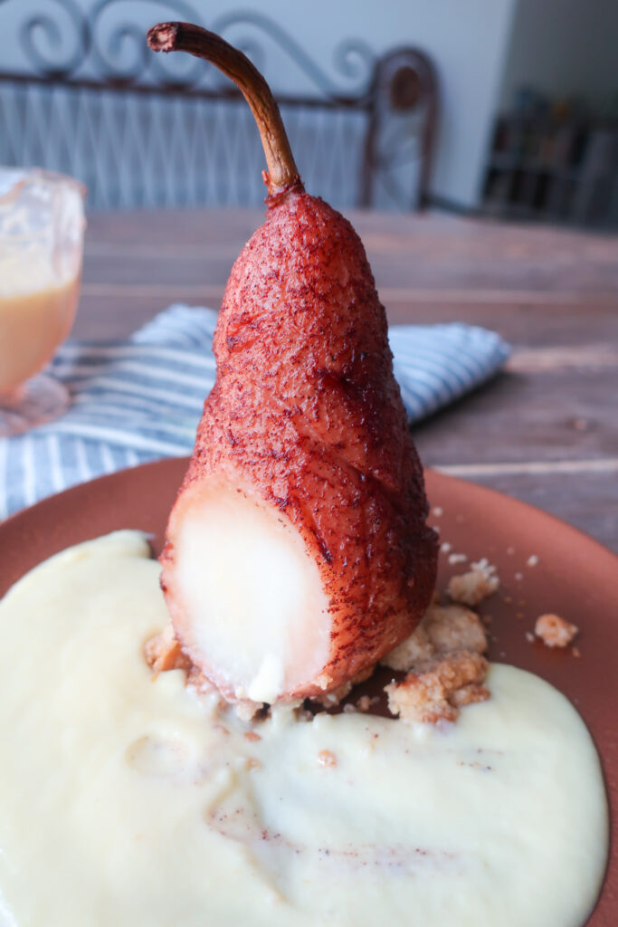 inside look at single serve spiced poached pear with streusel and creme anglaise