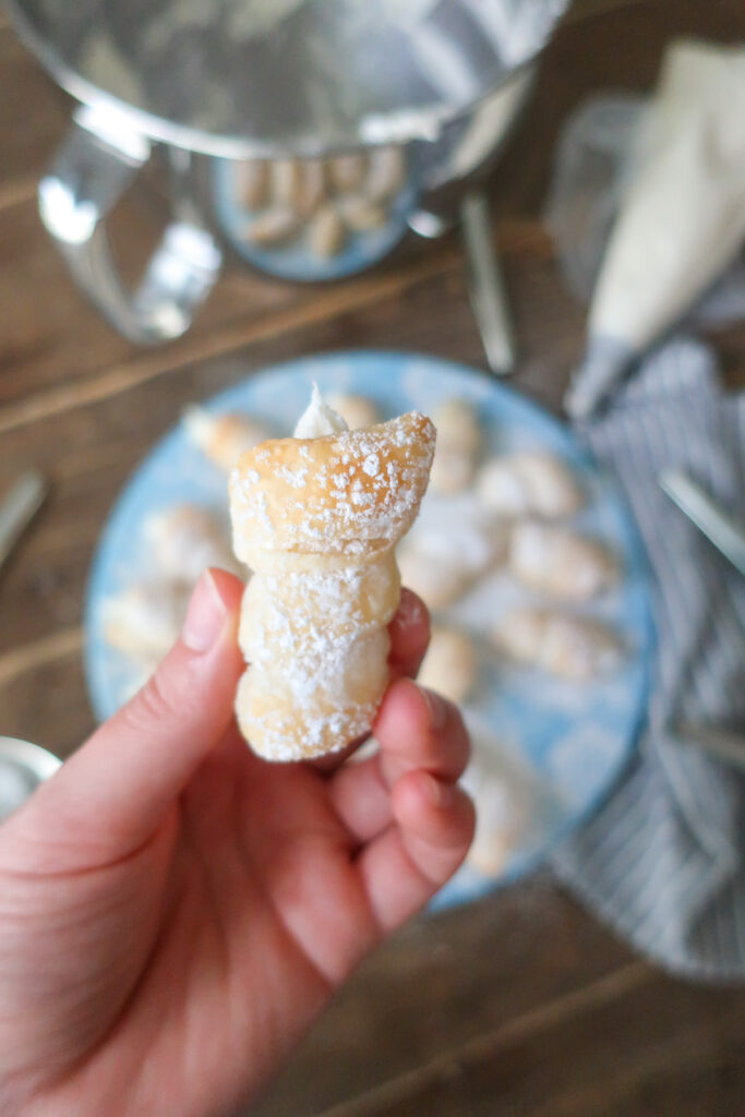 up close lady lock puff pastry filled with cream frosting