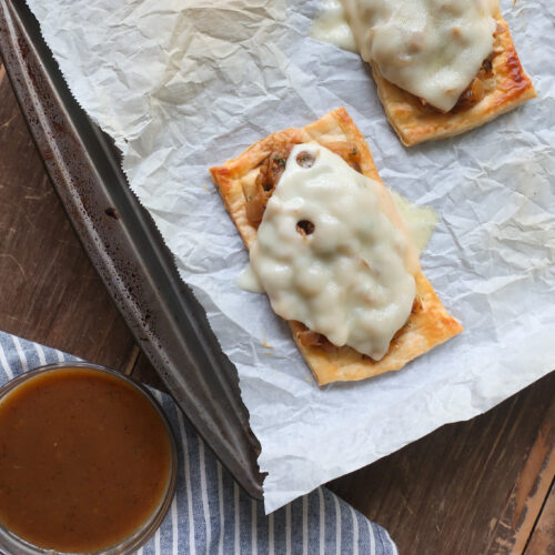 melted cheese on top of French Onion Puff Pastry with Gravy