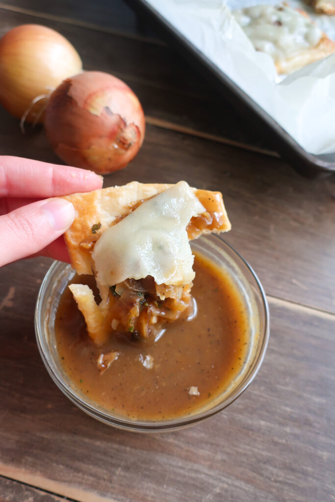 French Onion Puff Pastry with Gravy half dipped in onion gravy