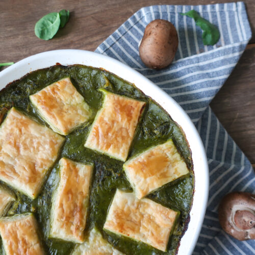 spinach and mushroom chicken pot pie topped with puff pastry