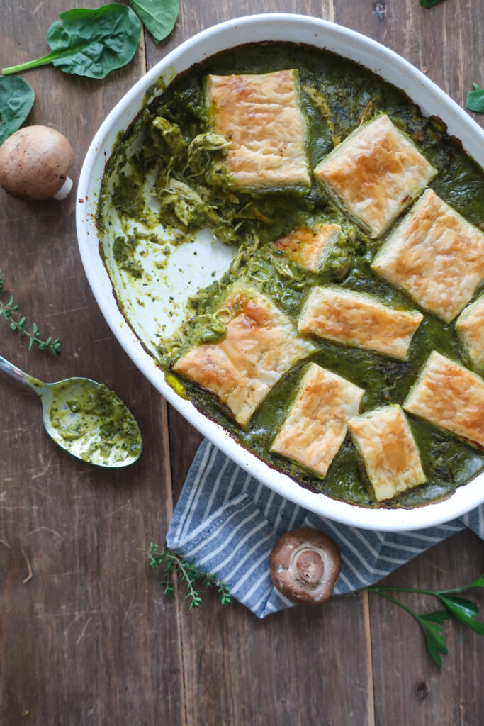 spinach and mushroom chicken pot pie topped with puff pastry