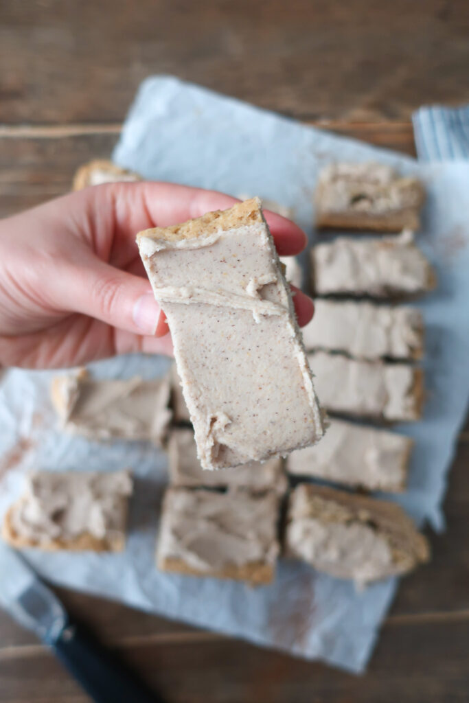 close up top of snickerdoodle bars with brown butter cinnamon frosting