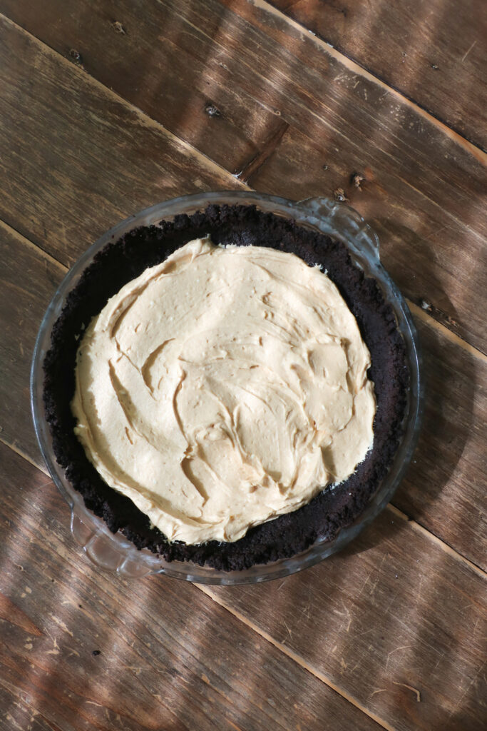 peanut butter layer inside oreo crust of no bake chocolate chip cookie peanut butter pie